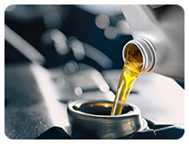 Engine oil pouring from can into engine, representing Gulf Way’s wide lubricant applications