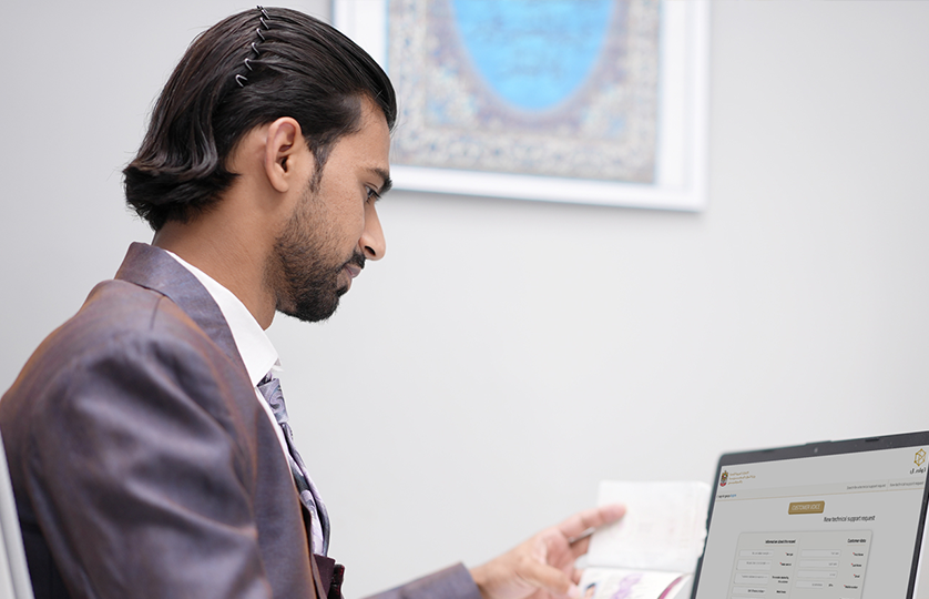 Gulf Way Oil Trading PRO team member focused on digital documentation and regulatory support on a laptop